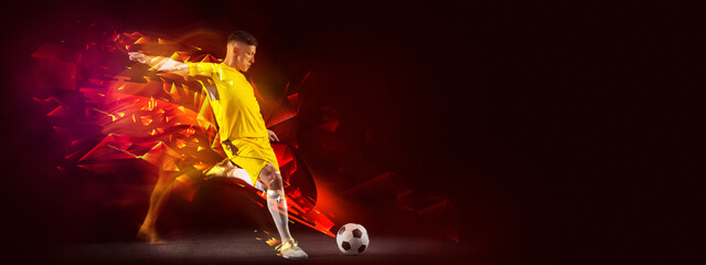 Flyer. Creative artwork with soccer, football player in motion and action with ball isolated on dark background with polygonal and fluid neon elements. Art, creativity, sport