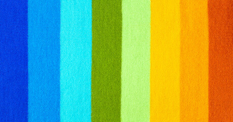 multi colored background. knitted wool fabric texture with stripes