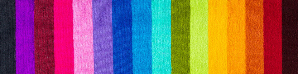 Fototapeta premium multi colored background. knitted wool fabric texture with rainbow stripes