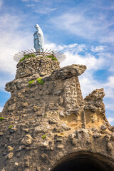 White statue of the Virgin Mary on the Rocher de la Vierge rock in Biarritz, France