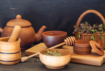 medicinal herb thyme brewed in a teapot, and honey