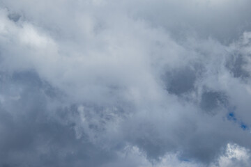 Cloudscape with shapes and faces image for background use