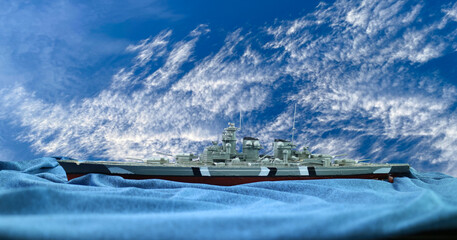 Assemble of  German warship plastic model with  clouds sky background ,hobby,German battleship...
