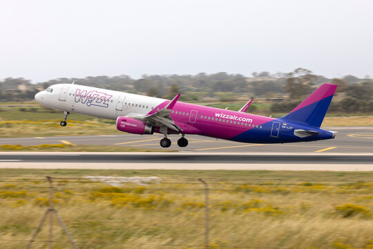 Luqa, Malta - April 14, 2022: Wizz Air Airbus A321-231 (REG: HA-LXT) lifting off from runway 13, destination: Warsaw, Poland.