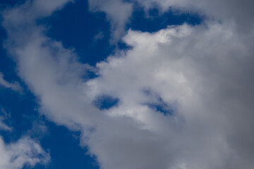 Cloudscape with shapes and faces image for background use