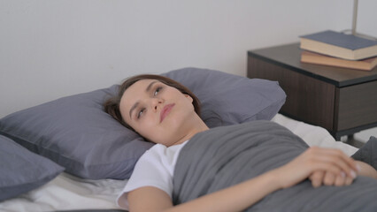 Woman Awake in Bed Thinking