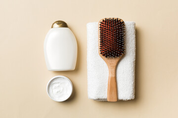 cosmetic for hair care, cream and towel on a colored background top view. flat lay