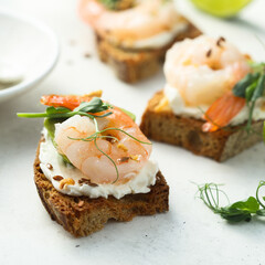 Roasted shrimps with cream cheese on toast
