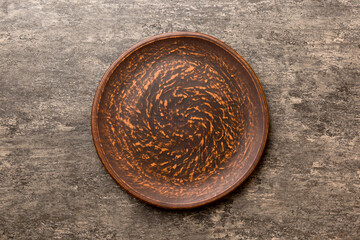 Top view of empty plate on cement background. Empty space for your design