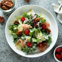Leaf salad with jamon and raspberry