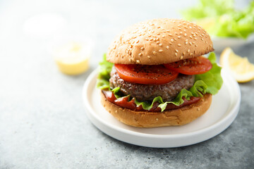 Traditional homemade burger with fresh tomato