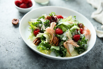 Leaf salad with jamon and raspberry