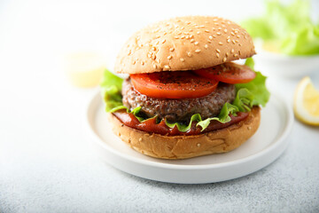 Traditional homemade burger with fresh tomato