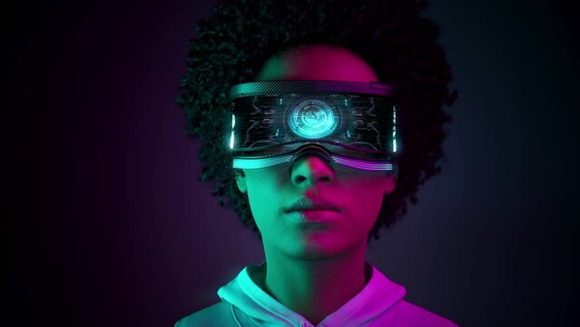 Metahuman. Beautiful young African Americans black woman using virtual or augmented reality glasses. High AR technologies in entertainment and education. Neon background. 3d Animation. 4K. 