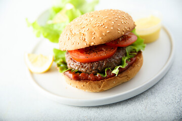 Traditional homemade burger with fresh tomato