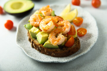 Shrimp toast with tomato and avocado