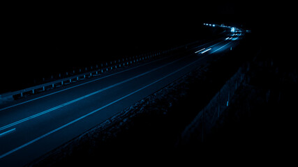 Fototapeta na wymiar blue car lights at night. long exposure