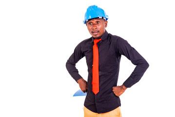young man engineer holding his hands on his hips.