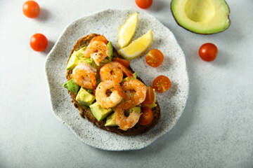 Shrimp toast with tomato and avocado