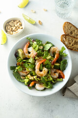 Healthy green salad with shrimps and avocado