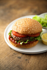 Traditional homemade burger with fresh tomato