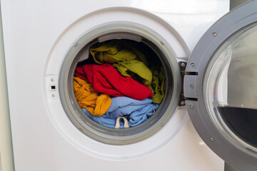 Bright clothes inside washing machine.