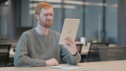 Man Reacting to Loss on Tablet