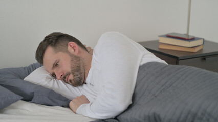 Fototapeta premium Man Unable to Sleep in Bed