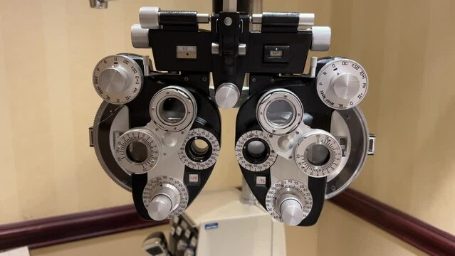 close look on phoropter machine used for eye examination and glasses tests in ophthalmology, optometry, and optician offices