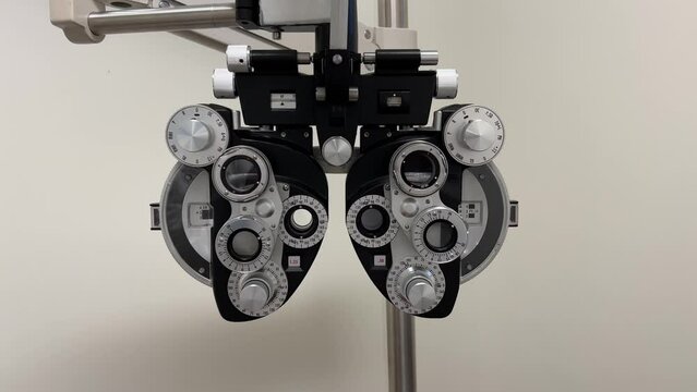 close look on phoropter machine used for eye examination and glasses tests in ophthalmology, optometry, and optician offices