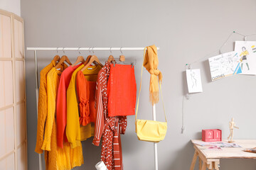 Rack with stylish clothes in modern studio of fashion stylist