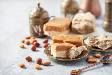 Oriental sweetness. Greek (Turkish) brewed coffee, nougat  and  halva on a table.