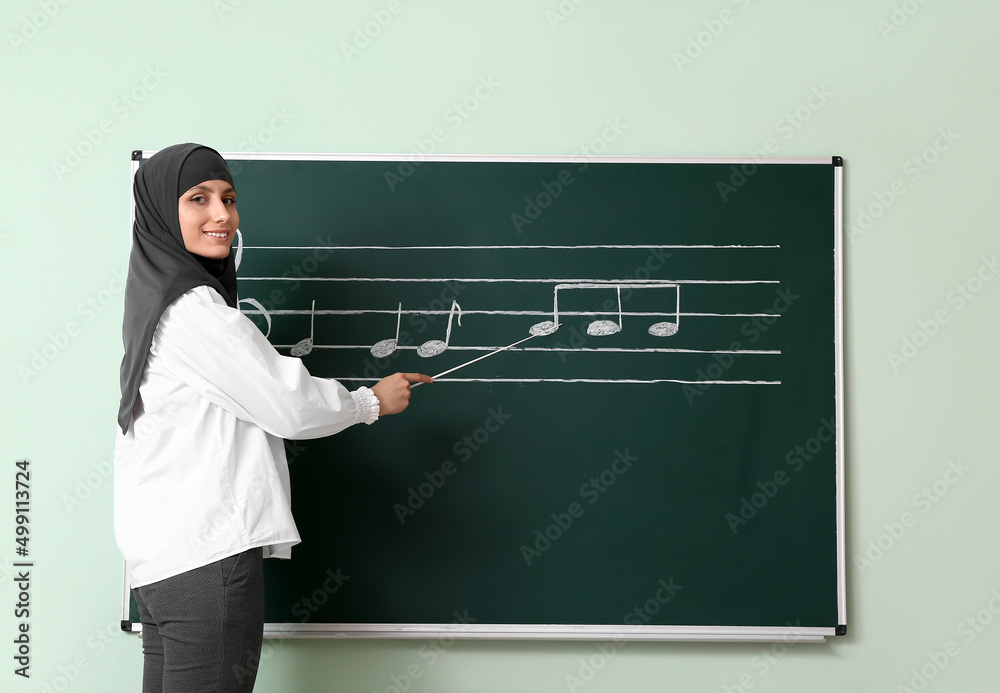 Canvas Prints Muslim music teacher giving lesson at school