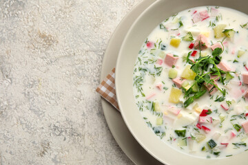 Plate with tasty okroshka on light background, closeup