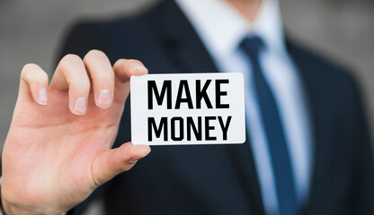 Make Money, Male holding a card with a message text written on it.