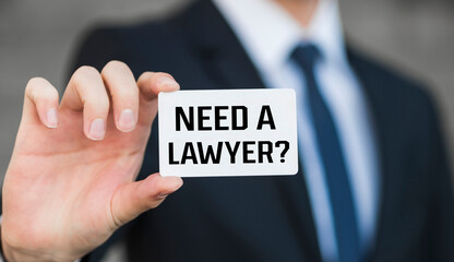 Need a lawyer? card in hand. Legal support and justice concept.