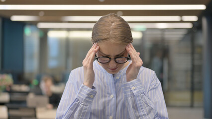 Fototapeta premium Portrait of Young Woman having Headache