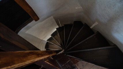 Spiral stairs in castle tower and white wall. Stairs spiral inside the lighthouse. Stairs spiral...