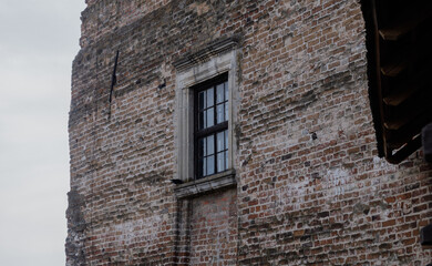 An old window of castle with white bricks