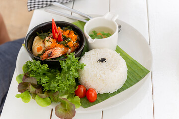 Thai famous dish pad kra pao stream rice with king prawn and vegetable soup. - obrazy, fototapety, plakaty