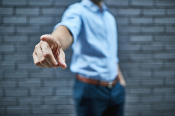 At the touch of a finger. Shot of a man pointing his finger forward.