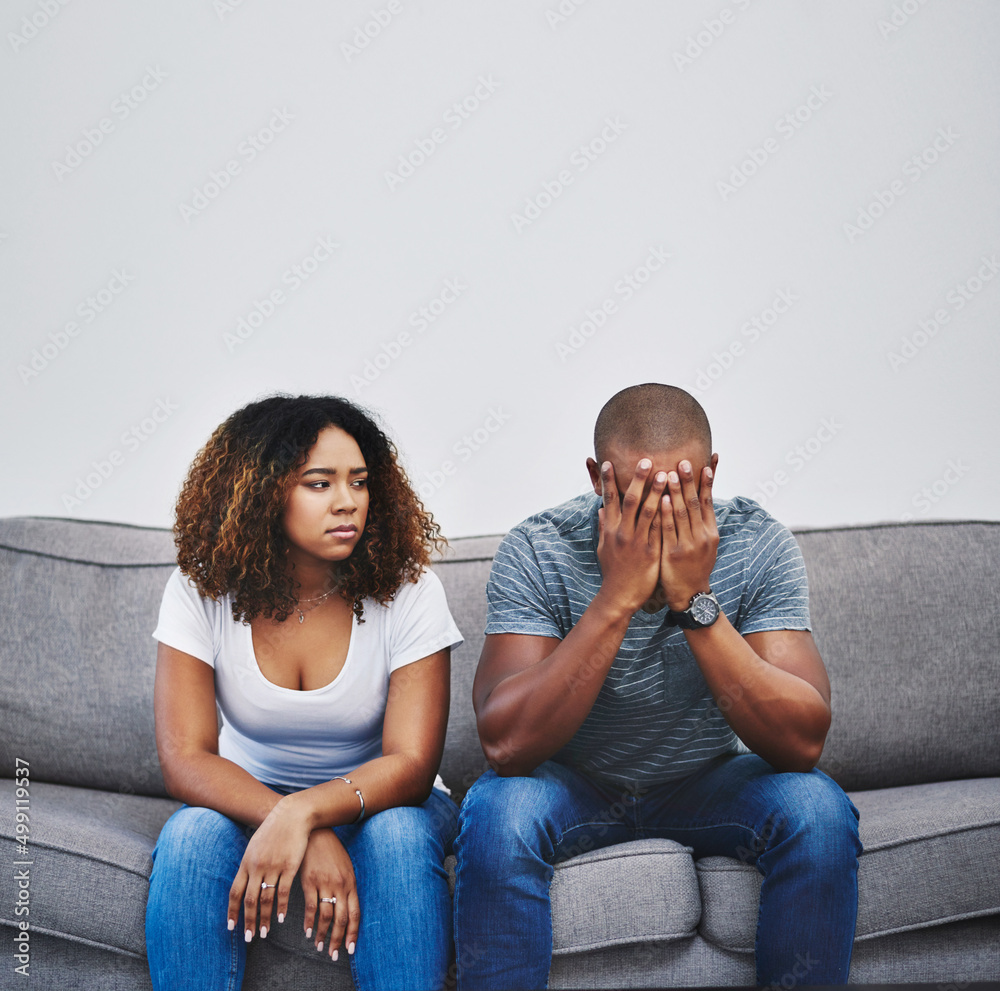 Poster have the walls closed in on their relationship. shot of a young couple having relationship problems 