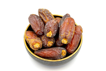 Date fruit isolated on a white background. A bowl of date fruit (Medjoul). close up