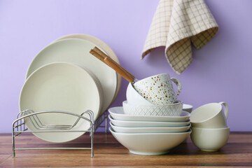 Set of clean tableware in kitchen