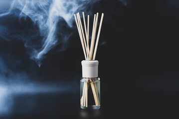 Home fragrance diffuser on dark background. Wellness and spa concept.