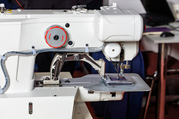 Sewing machine for stitching thick fabrics. Closeup.
