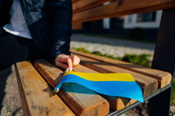 woman holding flag of ukraine on the street