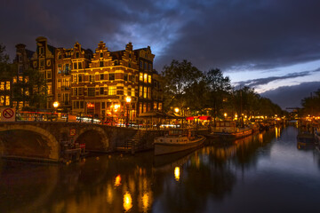 Embankment of the Amsterdam Canal on a Cloudy Evening