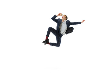 Studio shot of young male ballet dancer wearing business suit dancing isolated on white studio background. Business, start-up, art, work, caree, inspiration concept.