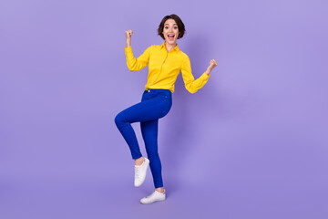 Fototapeta premium Full size photo of hooray millennial brunette lady yell wear shirt trousers sneakers isolated on purple color background